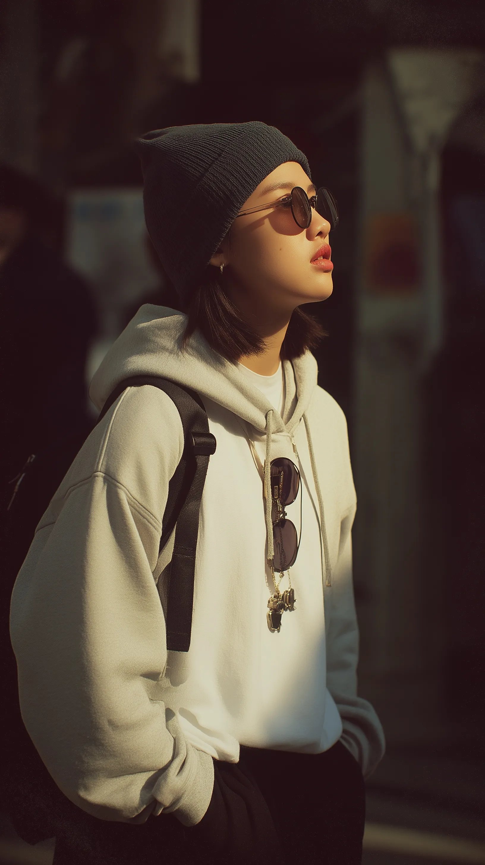 A young Korean woman in an early 2000s Hongdae outfit, wearing a beanie and hoodie, captured in a candid film style.