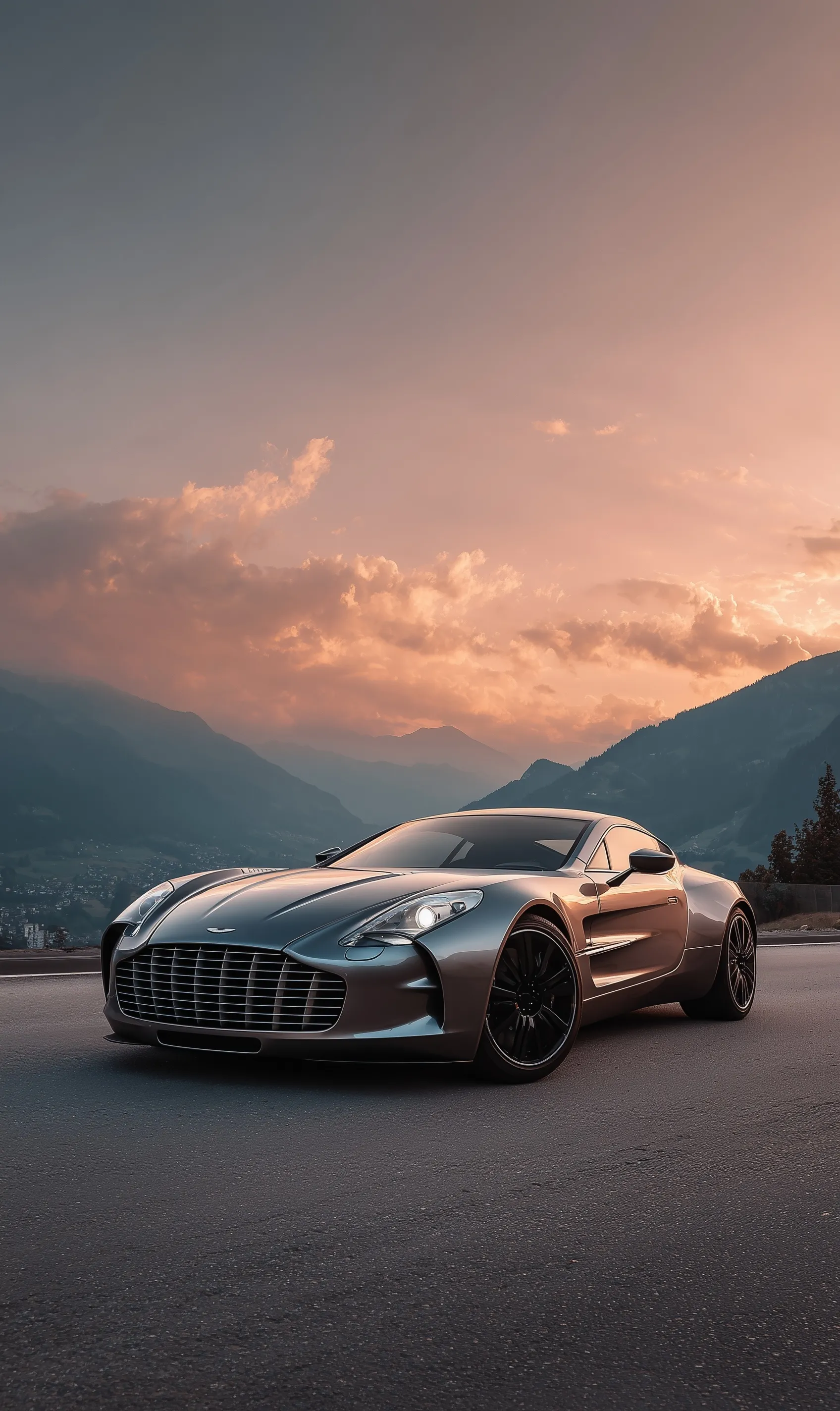 Aston Martin One-77 metallic sports car parked on a mountain road at sunset, high-resolution iPhone wallpaper.