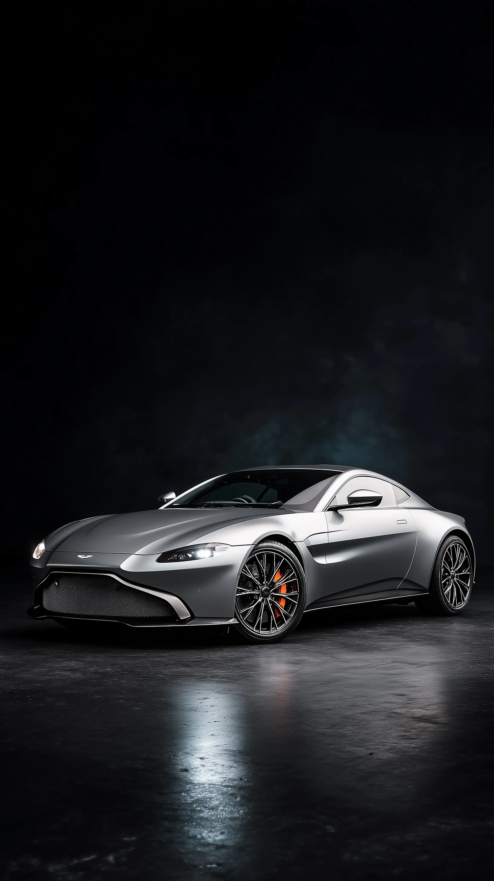 A sleek silver 2020 Aston Martin Vantage V8 on a dark black background, magazine cover style aesthetic.