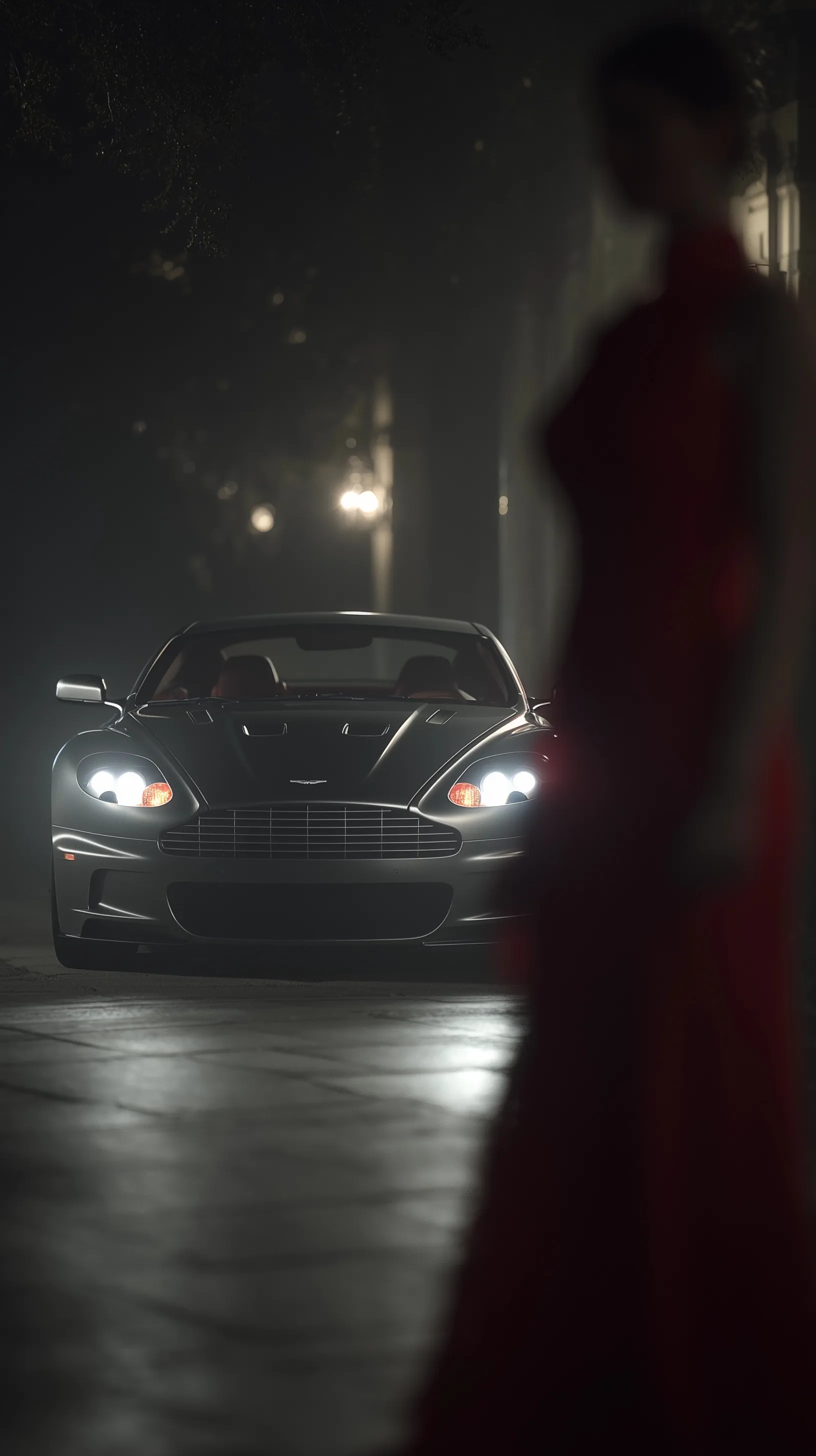 A dark gray 2010 Aston Martin DBS with glowing headlights and a woman in a red dress, cinematic iPhone wallpaper.