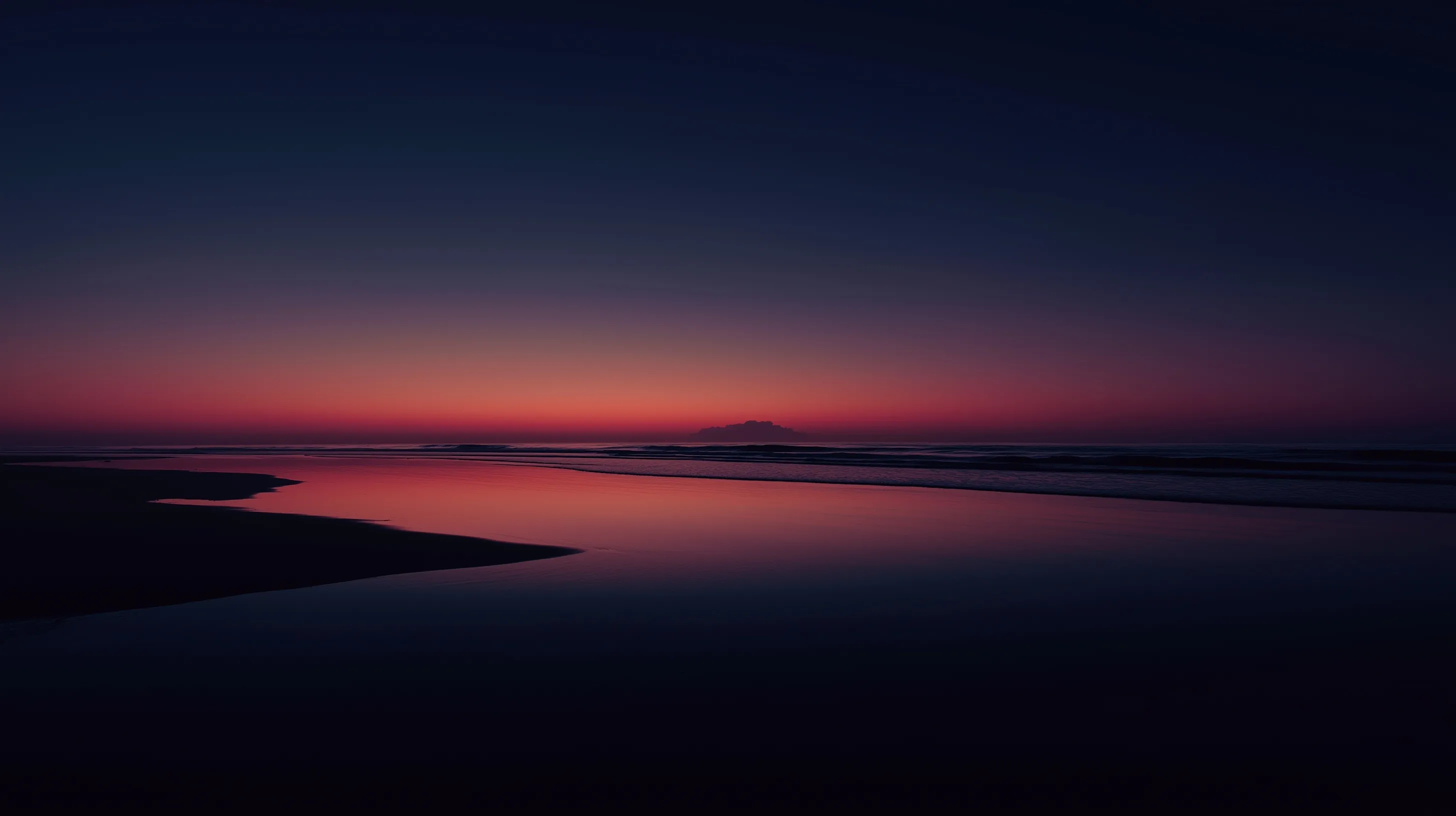 Minimalist sunset over the west horizon with calm sea, creating a peaceful beach dusk aesthetic.