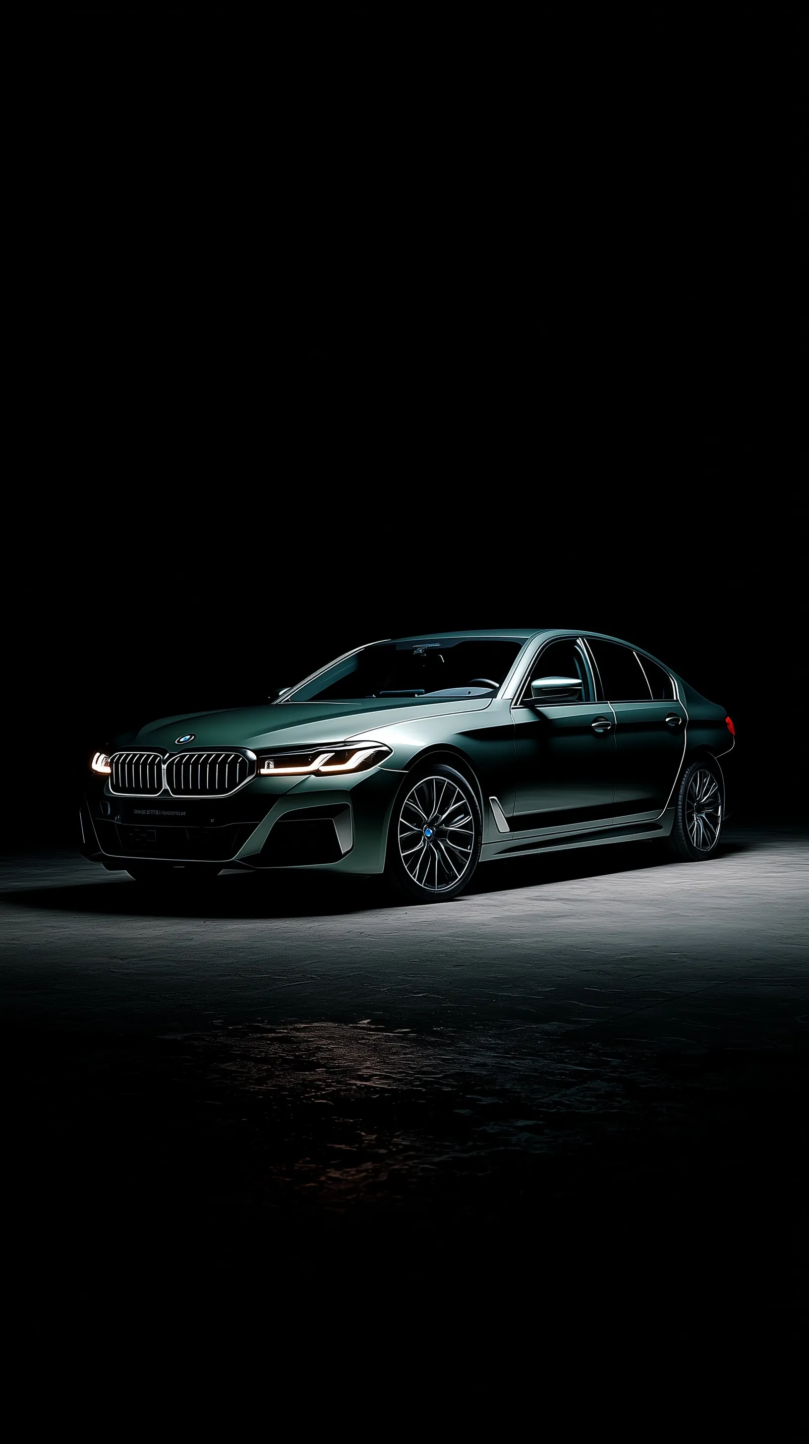 A sleek dark green BMW 5 Series sedan illuminated against a pitch-black background, professional automotive photo.