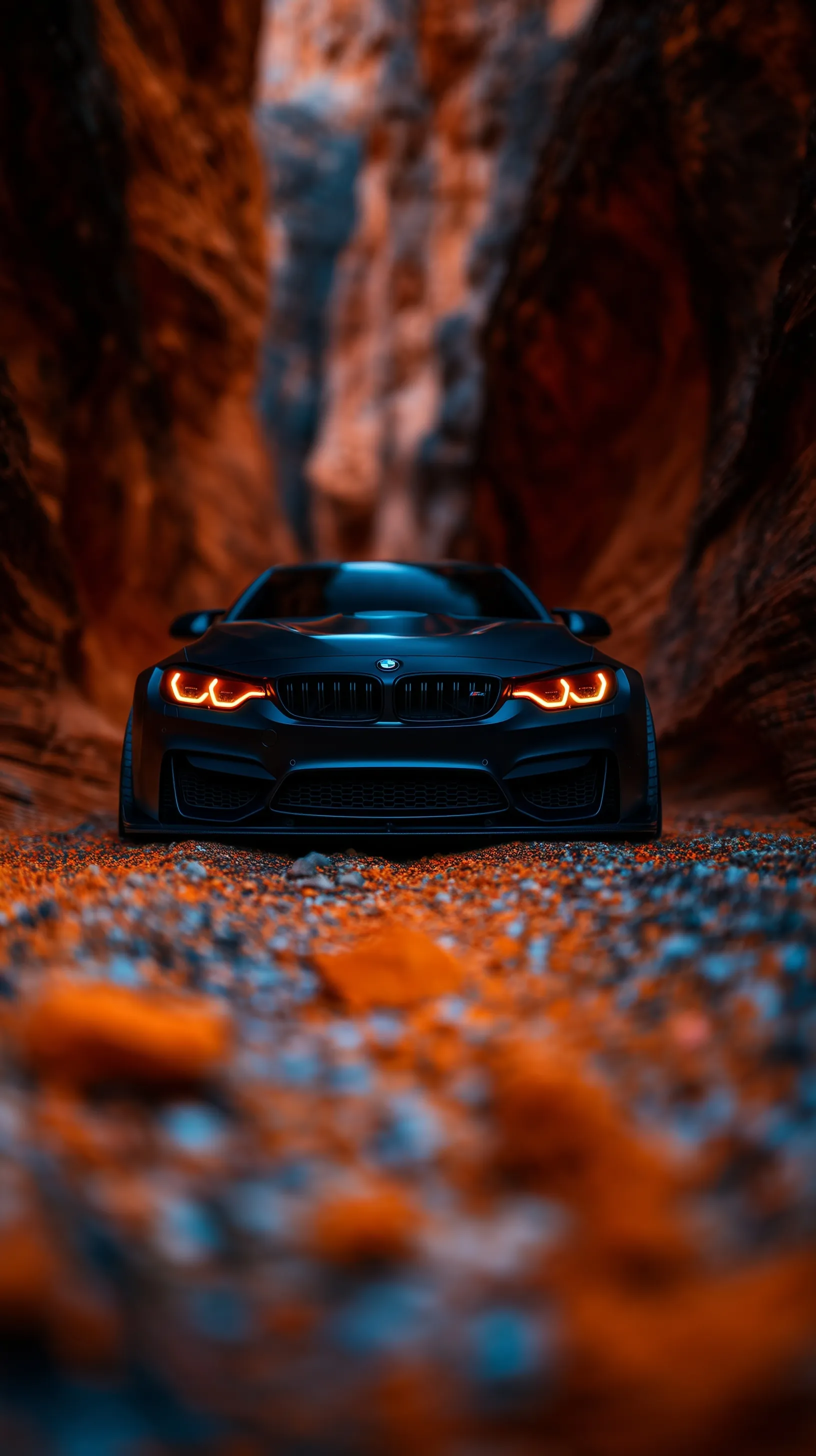 Modified jet-black 2025 BMW M4 Competition on a scenic desert canyon road, cinematic vertical mobile wallpaper.