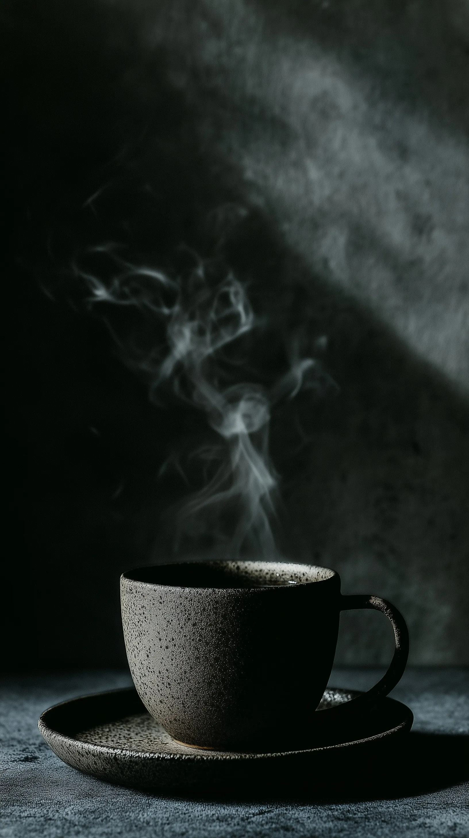 Macro shot of black coffee in a matte ceramic cup with soft steam, moody dark aesthetic, and cinematic lighting.