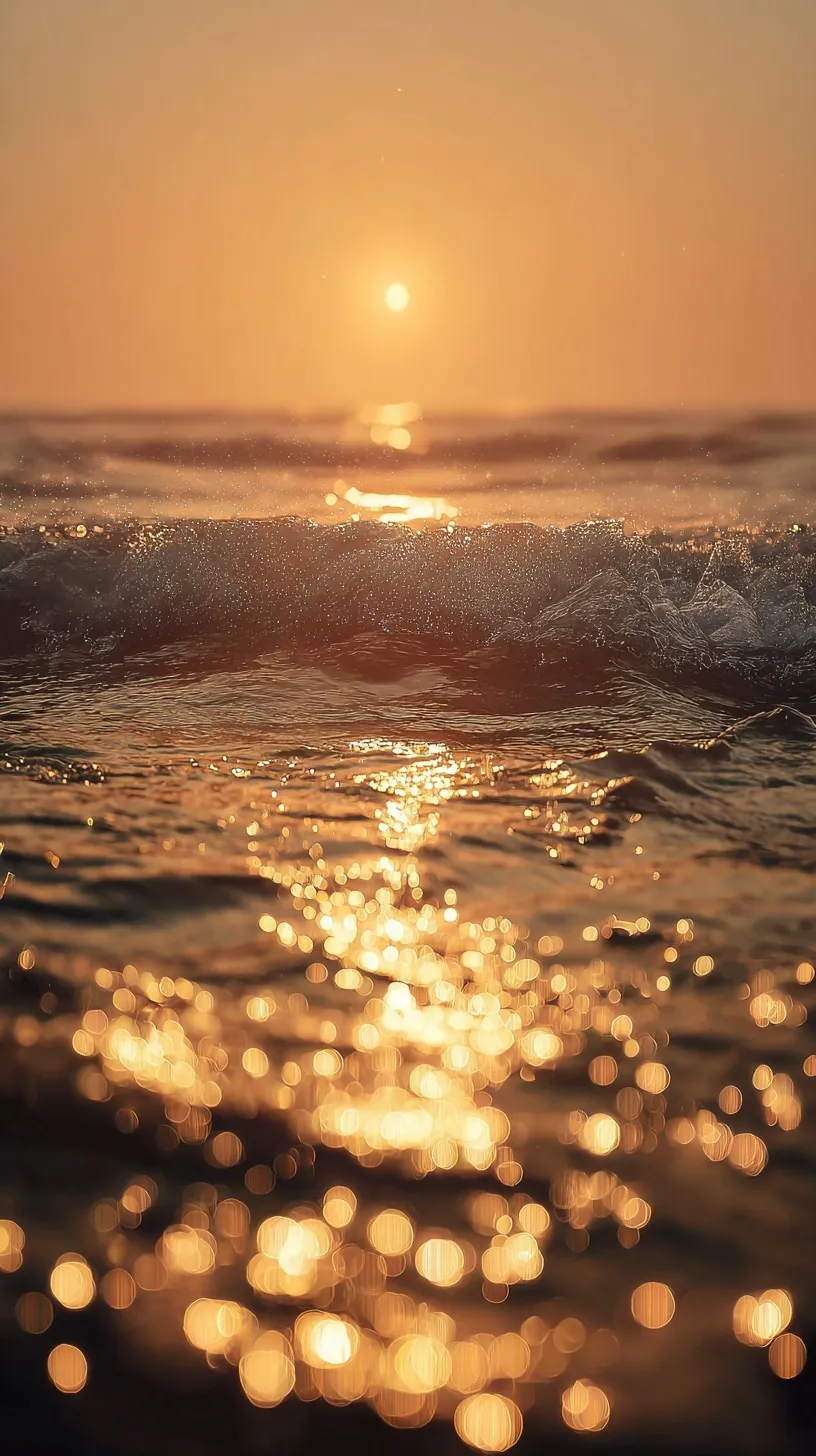Golden hour sunlight reflecting on tranquil ocean waves with sparkling bokeh, creating a dreamy sunset seascape.
