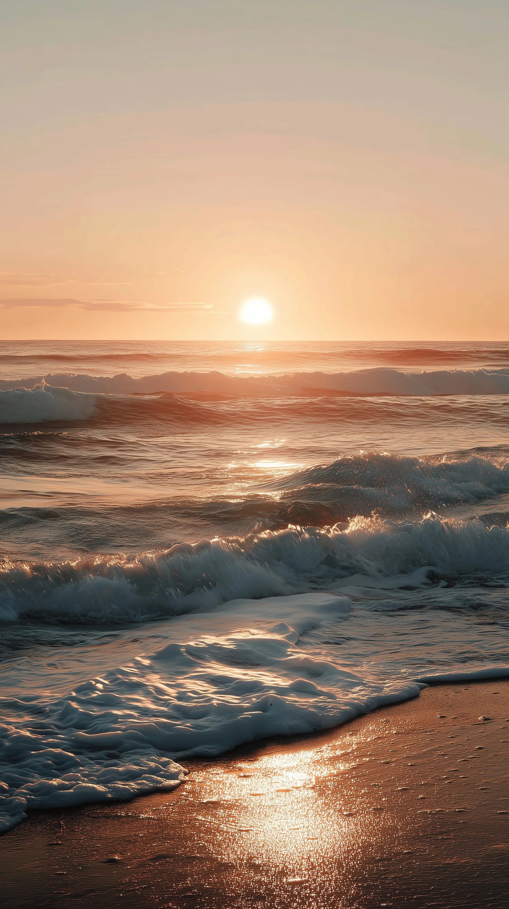Wide cinematic shot of a calm ocean at sunrise with soft golden light and a long, serene horizon line.