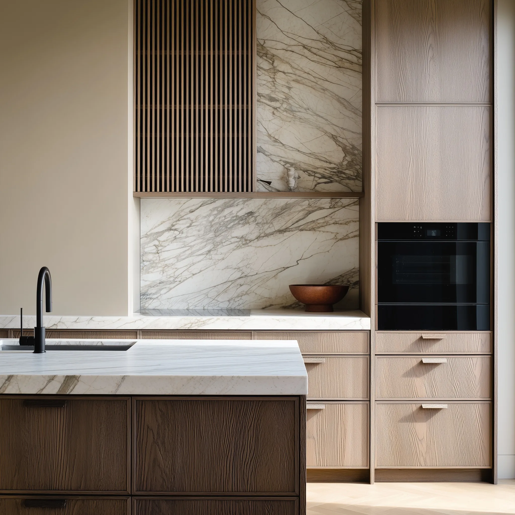 Minimalist luxury kitchen with dark oak cabinets, marble backsplash, and clean architectural lines.