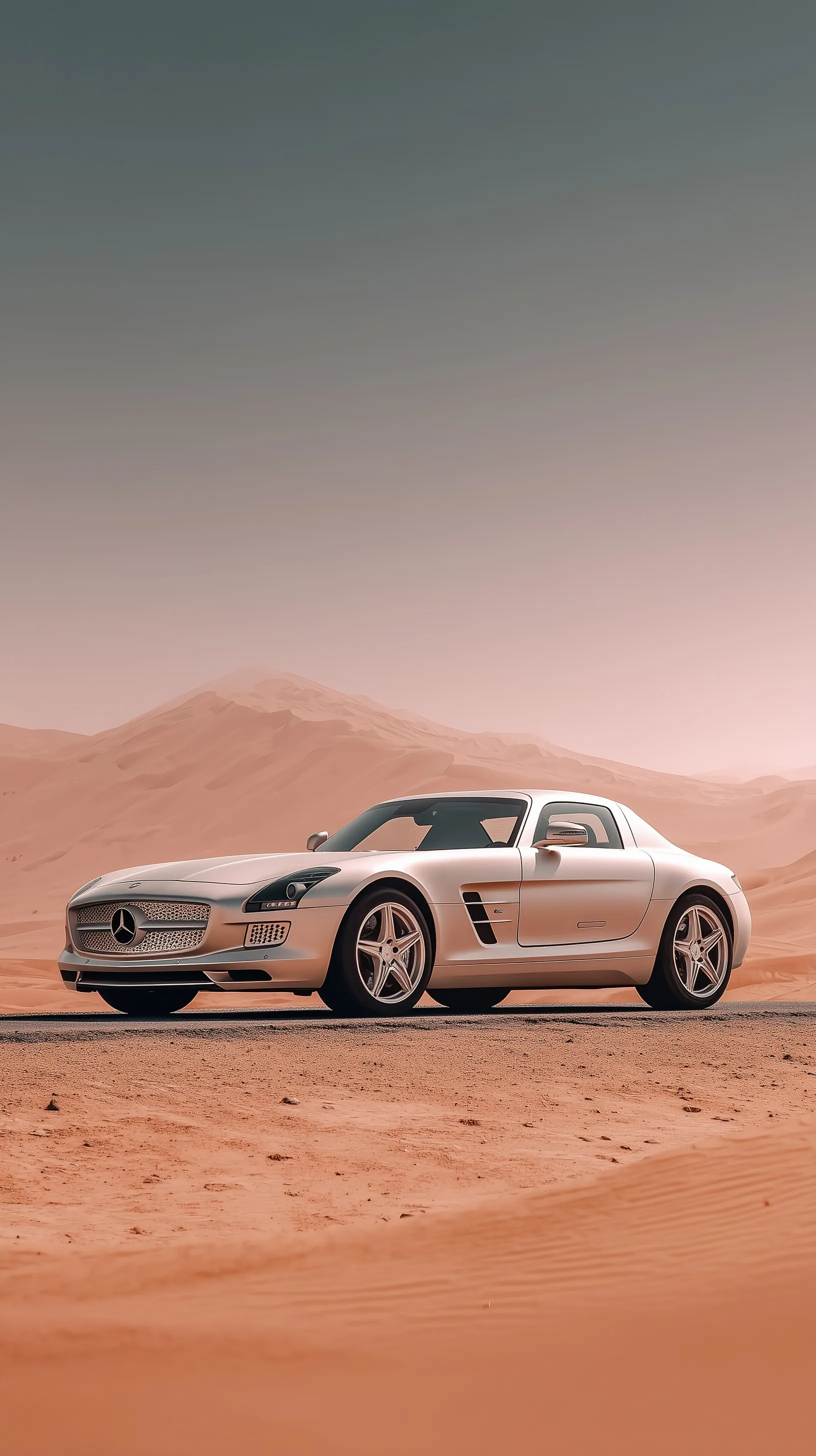 Silver 2011 Mercedes-Benz SLS AMG with gullwing doors on a deserted Dubai road at golden hour.