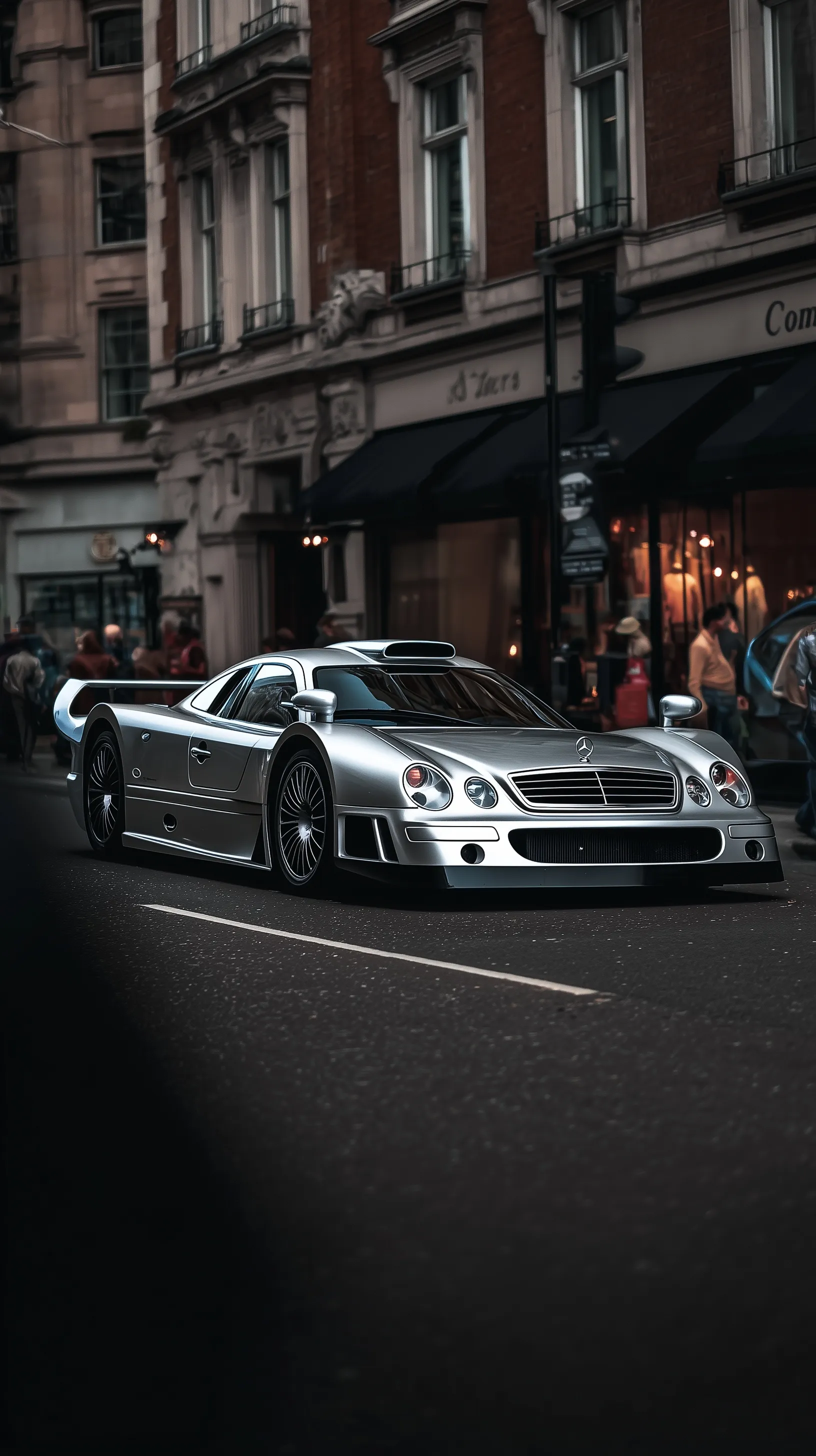 A cinematic street photography shot of a Mercedes CLK GTR parked on a city street, perfect for iPhone wallpaper.