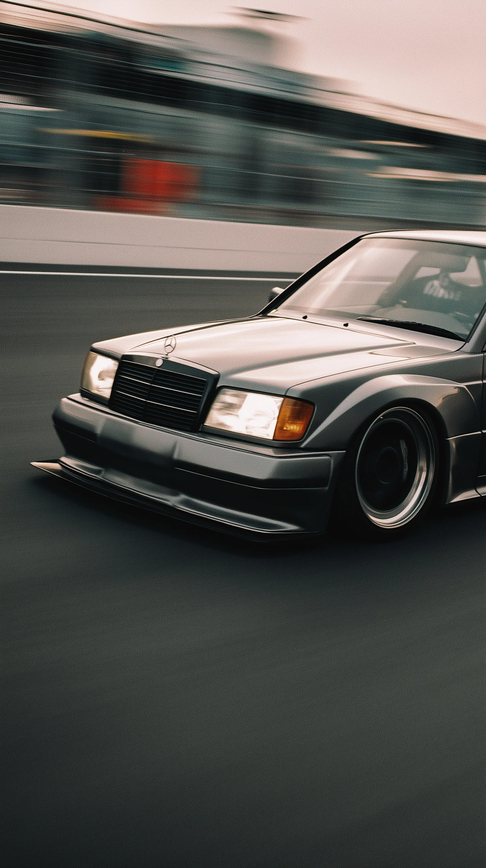 Slammed Mercedes-Benz W 202 DTM AMG in motion blur with a dark Portra 400H cinematic film aesthetic.