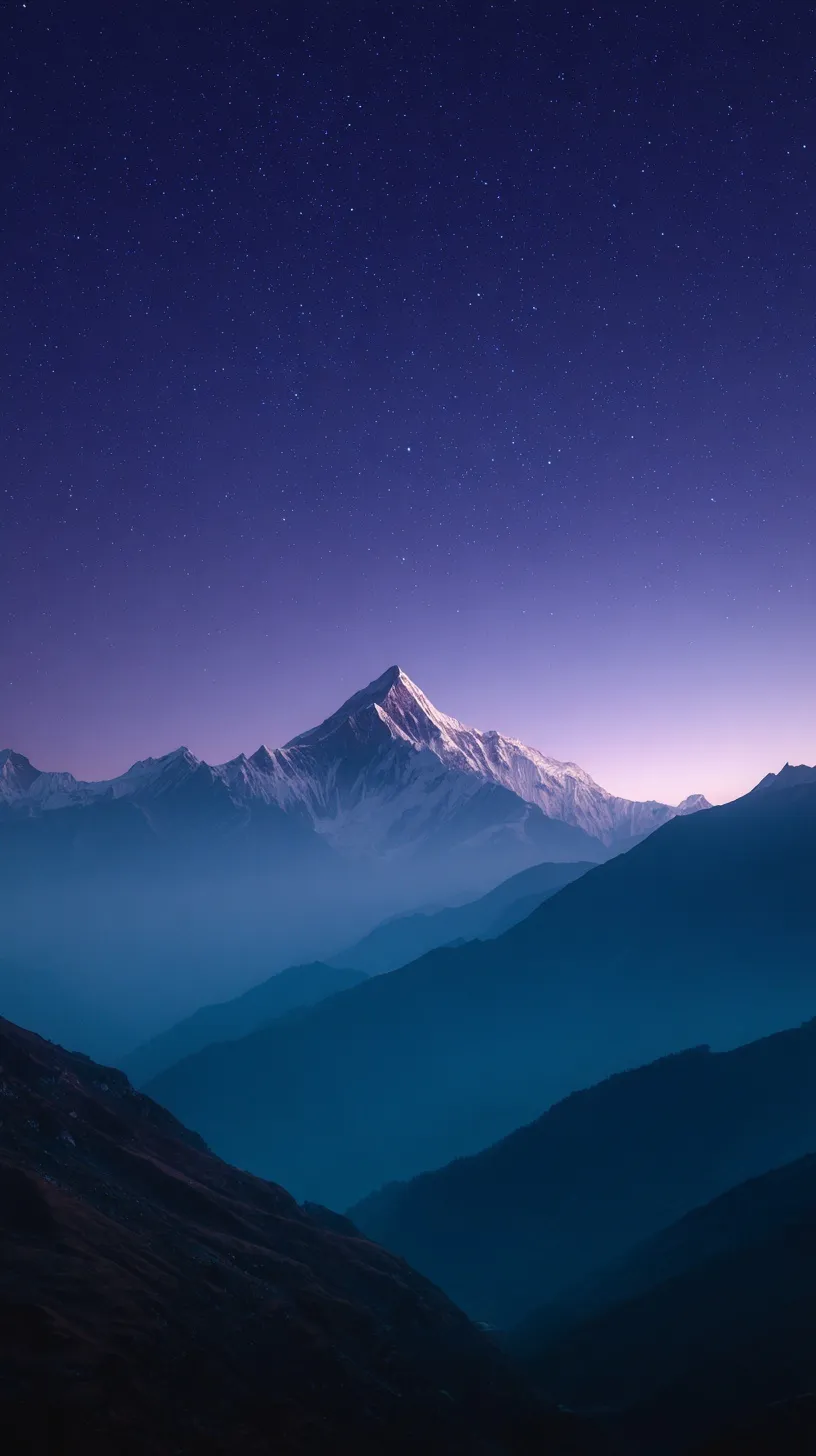 Serene night sky over Himalayan mountain peaks with misty valleys, perfect for iPhone 17 Pro Max wallpaper.