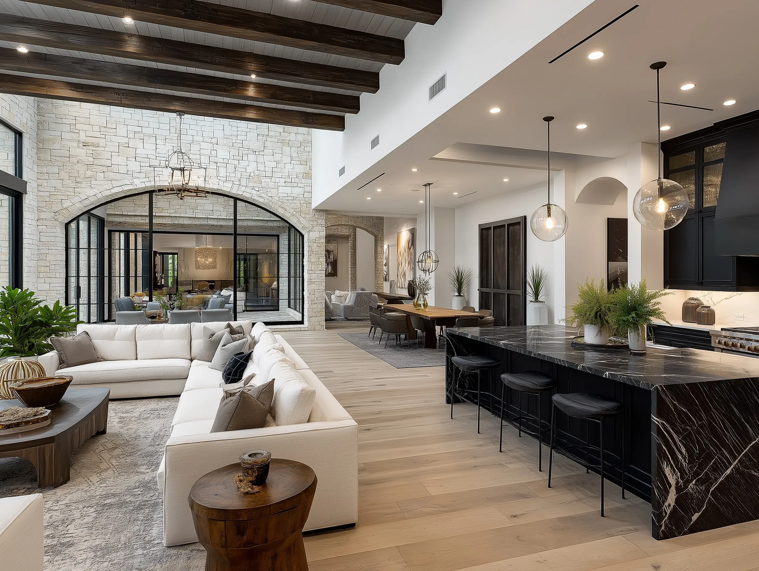 Modern luxury open concept kitchen interior in a spacious Texas home with premium finishes and warm lighting.