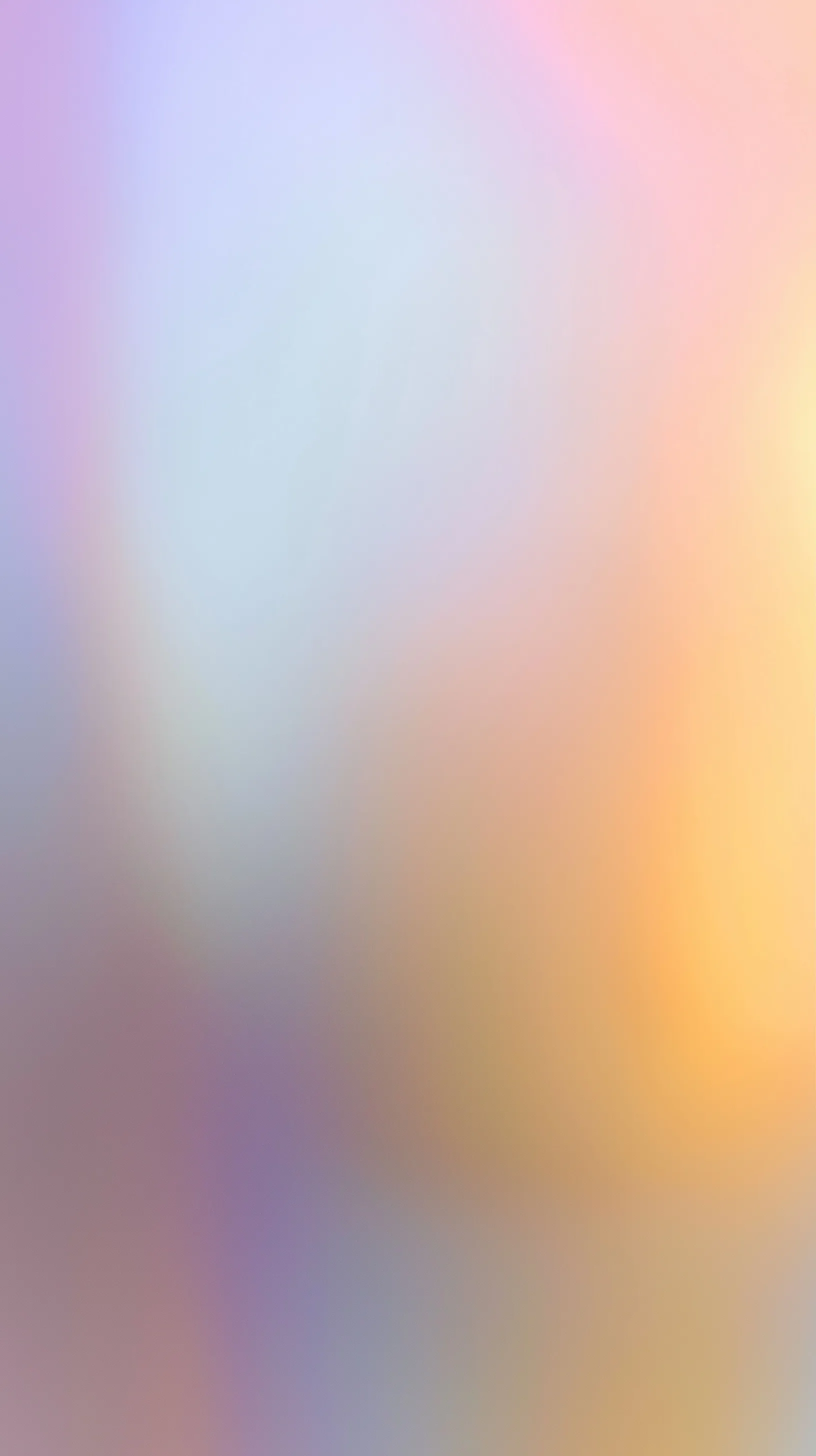 Abstract blurred gradient background in pastel lavender, rose, and gold, perfect for phone wallpapers.