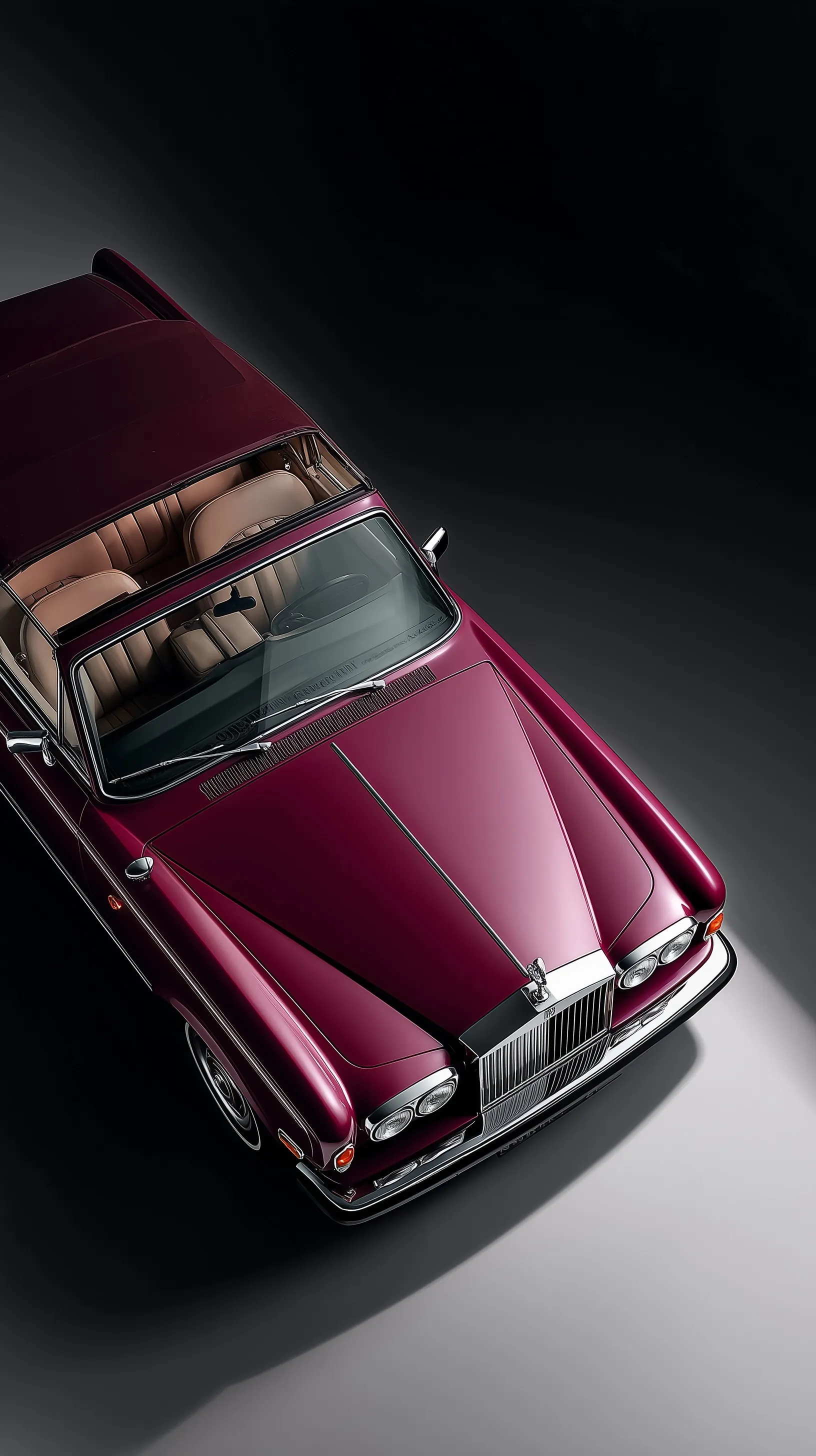 Vintage maroon Rolls-Royce Silver Shadow convertible with open doors against a minimalist gradient background.
