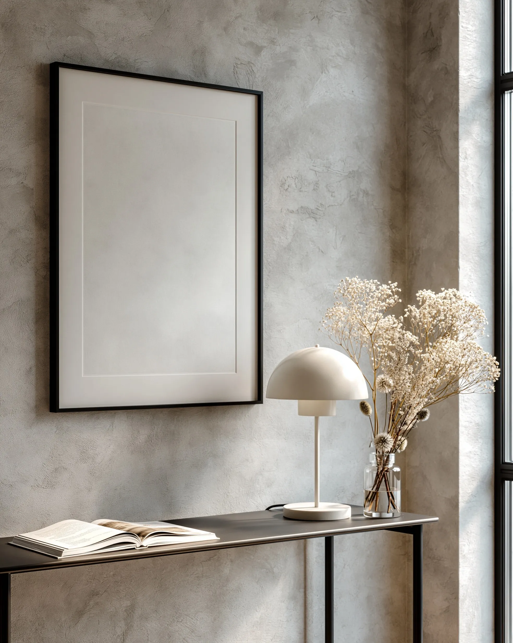 Minimalist console table with framed art mockup, lamp, and dried flowers in a serene, modern apartment interior.