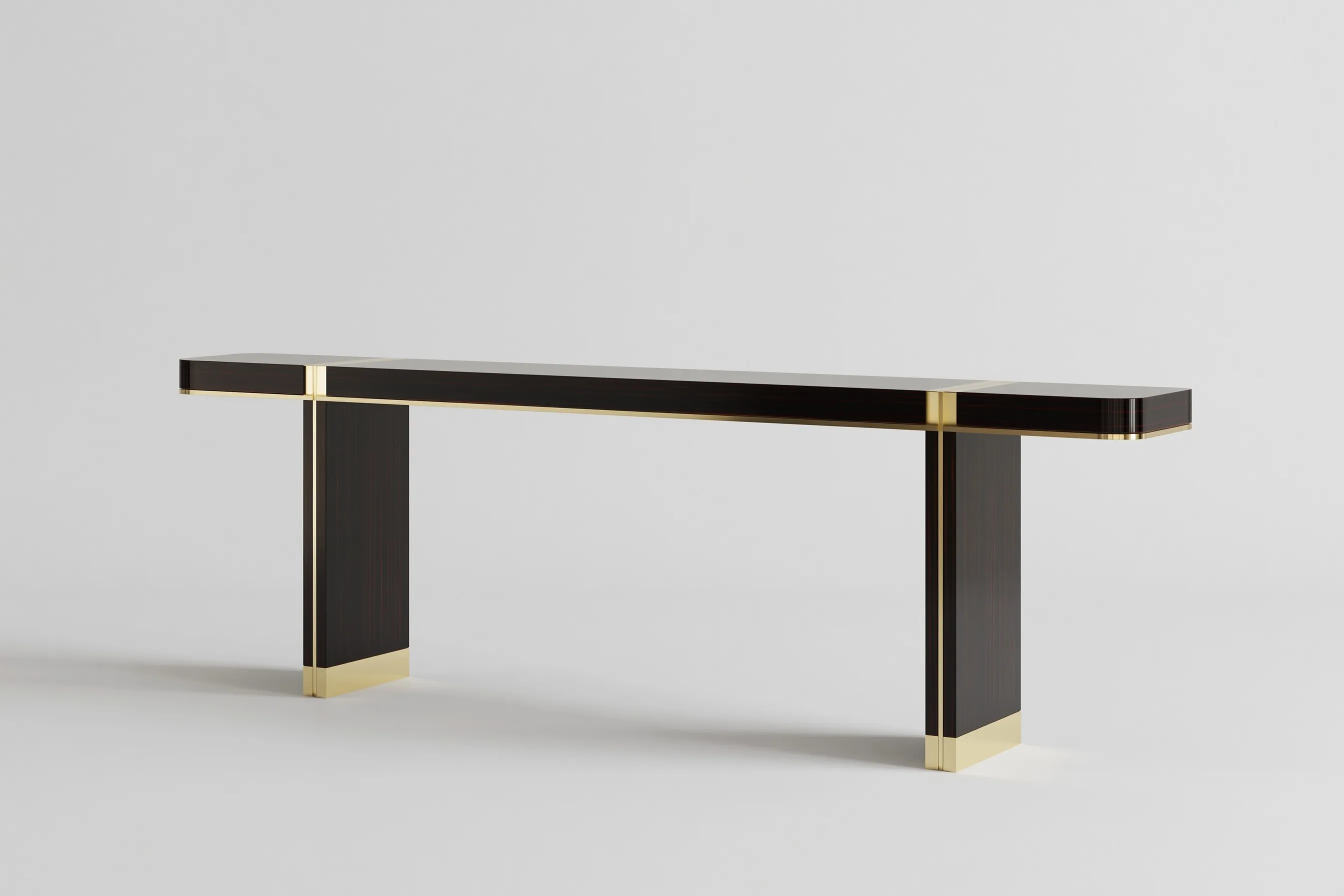 Minimalist ebony console table with gold accents in a professional studio photography style.