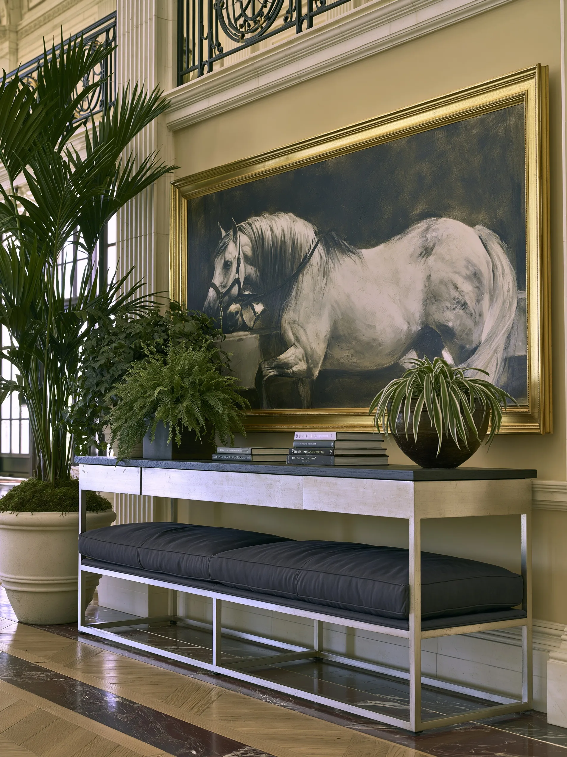 Panoramic horse art framed above a small console table in a luxury old money style hallway.