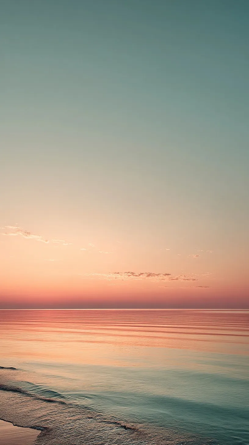 Minimalist sunrise ocean wallpaper with soft beige sand, dusty blue sky, and warm orange horizon in pastel tones.