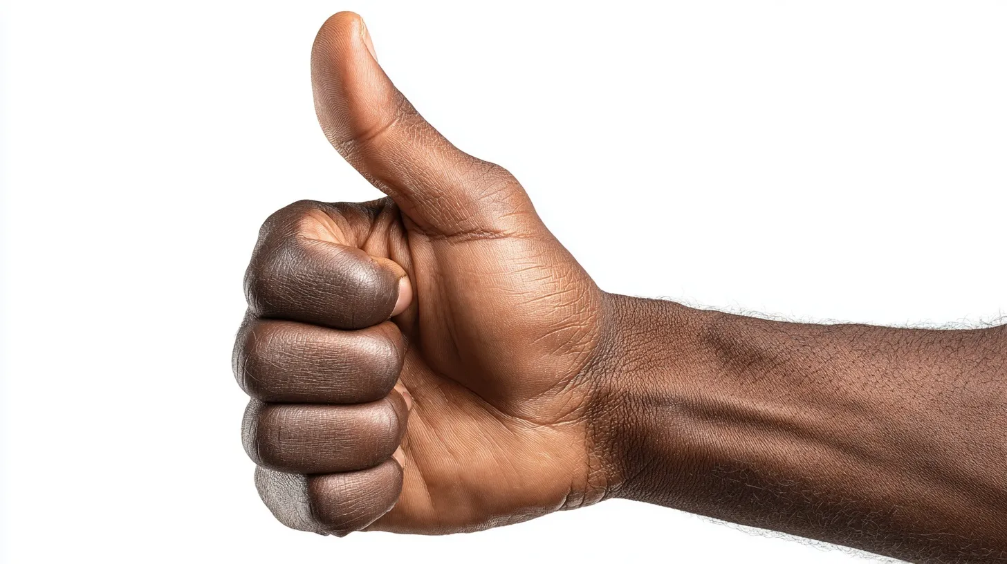 Mixed race hand showing a thumbs up gesture against a clean, stark white background.