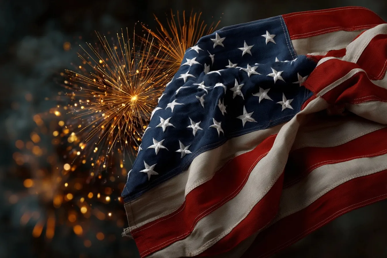A vibrant USA flag silhouetted against a night sky filled with colorful Independence Day fireworks.
