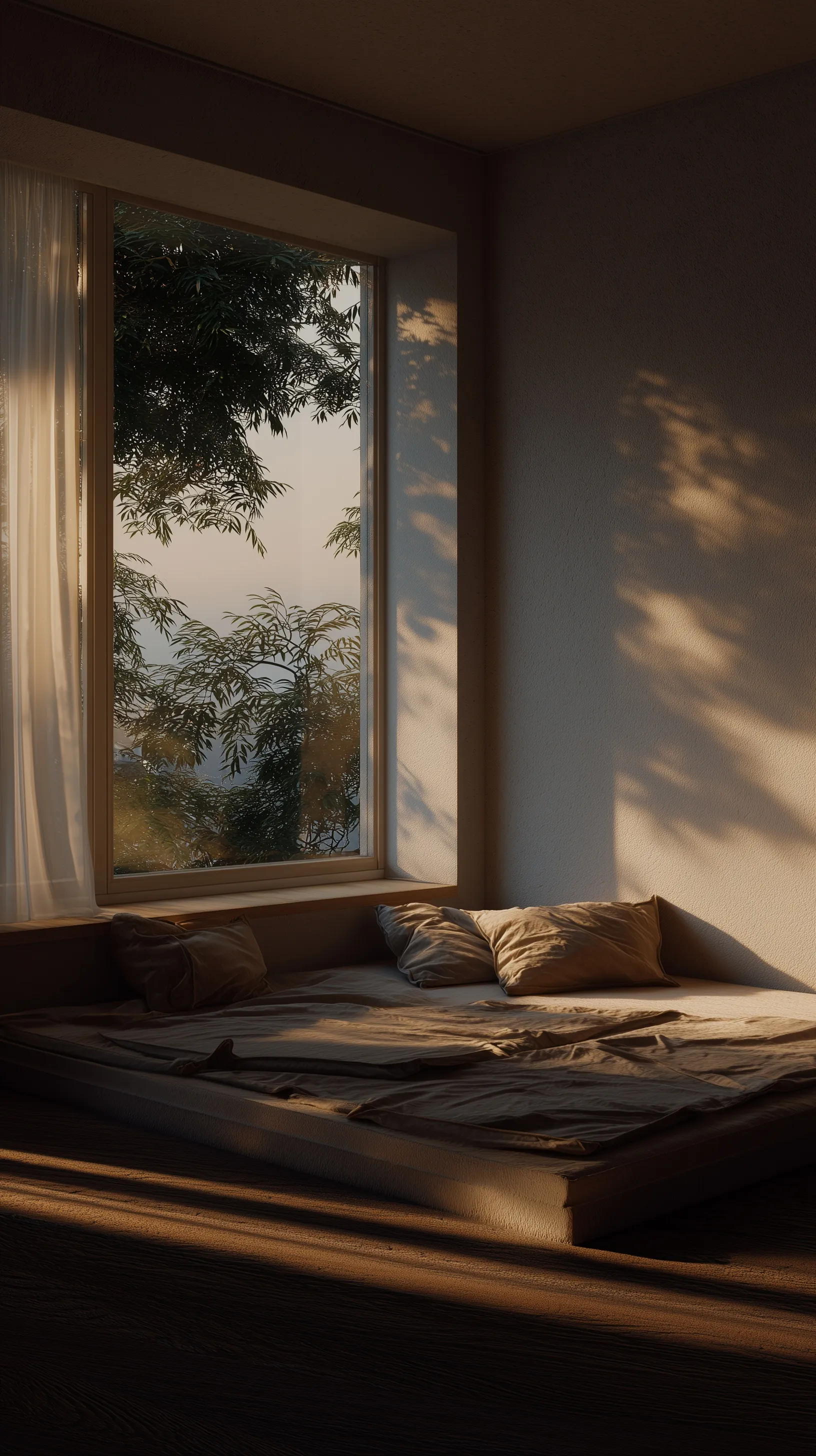 Minimalist bedroom with an empty, clean window sill in a bright, warm residential setting.